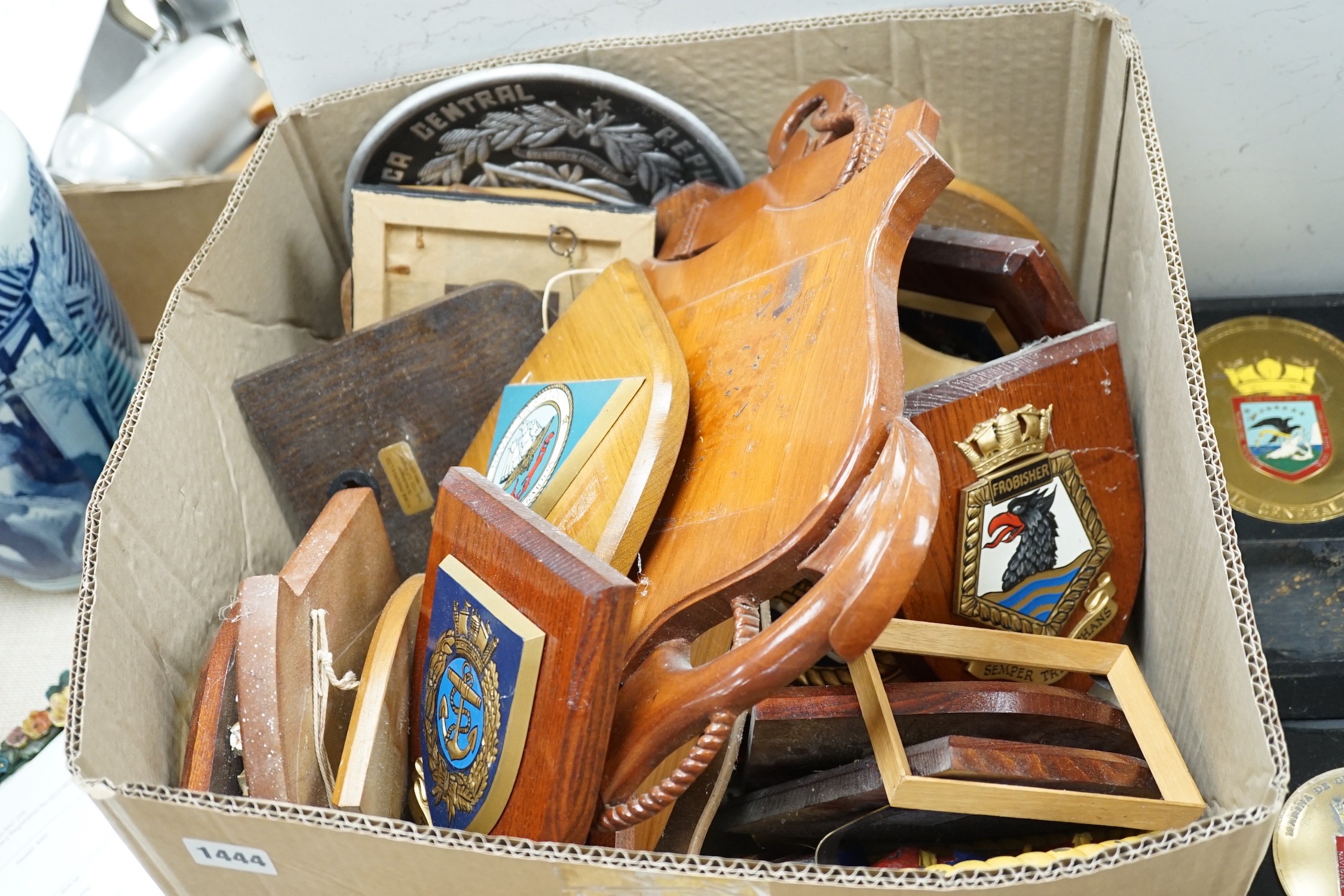 A collection of approximately twenty five plaster and other naval / military and Royal wall hanging plaques